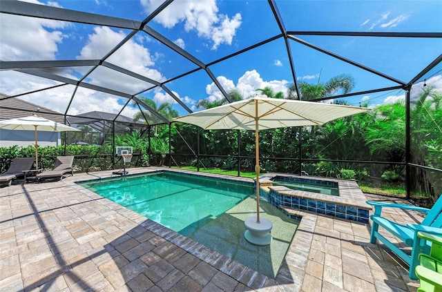 view of pool featuring an in ground hot tub, glass enclosure, and a patio