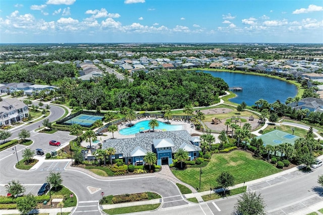 birds eye view of property with a water view