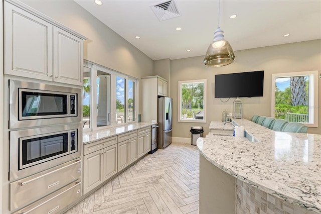 3360 Chestertown Loop, Bradenton, FL 34211 - kitchen featuring a sink, stainless steel appliances, a healthy amount of sunlight, and visible vents