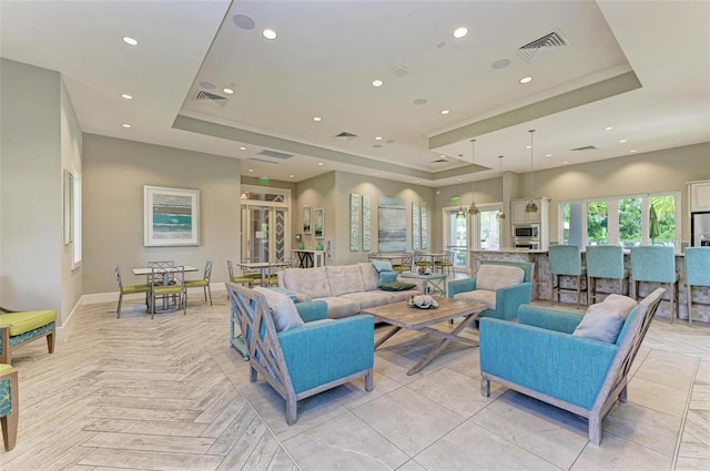 3360 Chestertown Loop, Bradenton, FL 34211 - living room featuring visible vents, a raised ceiling, and recessed lighting
