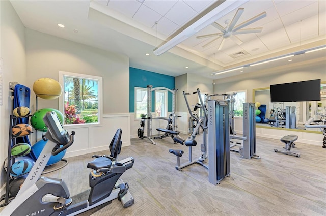 gym with light carpet and ceiling fan