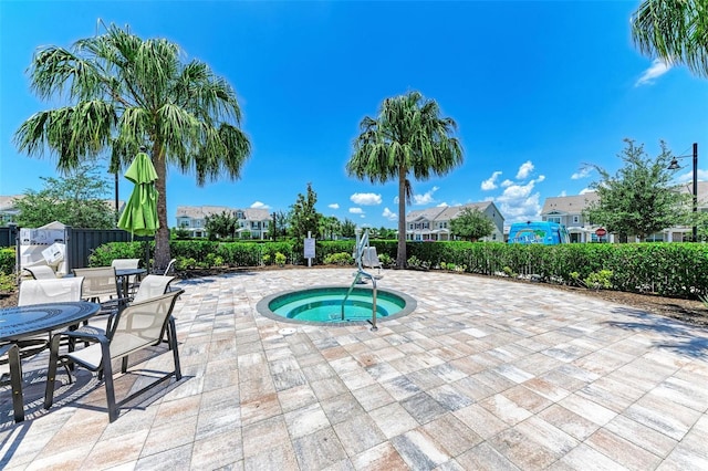 3360 Chestertown Loop, Bradenton, FL 34211 - view of pool featuring outdoor dining space, a community hot tub, fence, a patio, and a residential view