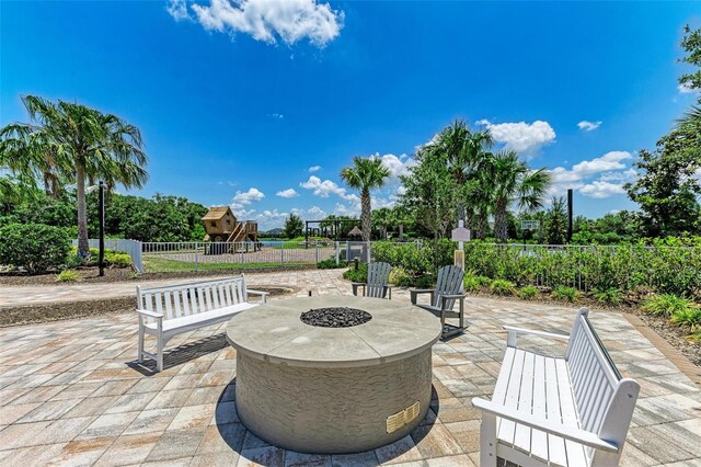 view of patio with an outdoor fire pit