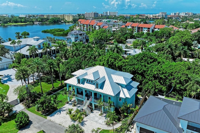 birds eye view of property with a water view