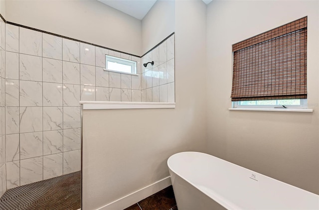 bathroom with plenty of natural light, separate shower and tub, and tile patterned flooring