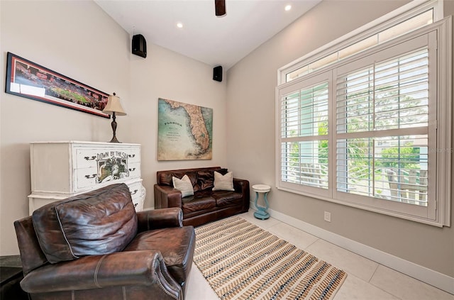 tiled living room featuring lofted ceiling