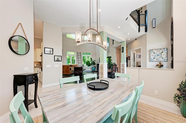 dining space featuring an inviting chandelier and light tile patterned floors