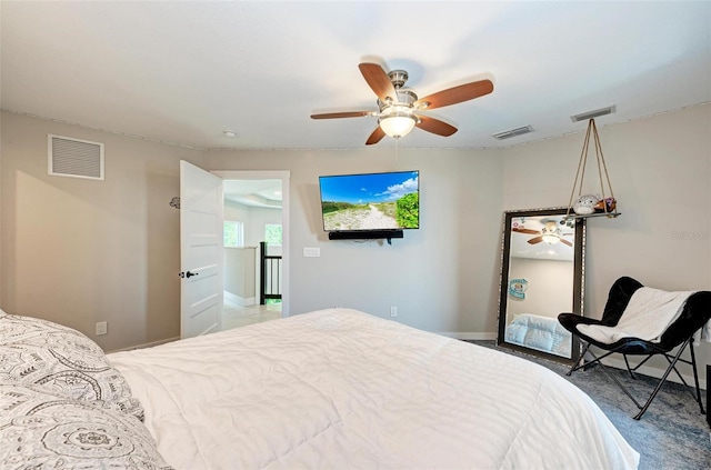 carpeted bedroom with ceiling fan