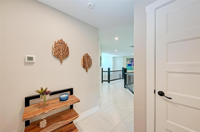 hallway with light tile patterned flooring