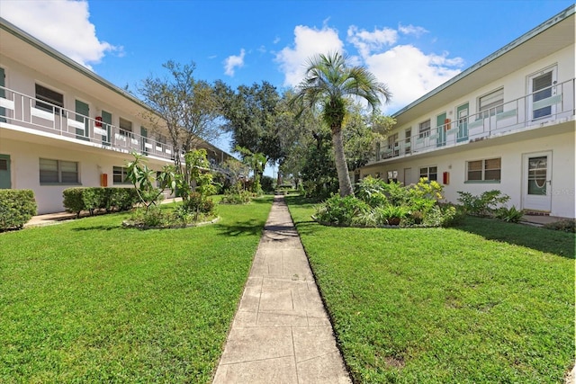 surrounding community featuring a yard