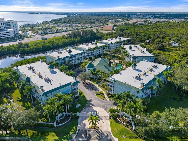 birds eye view of property with a water view