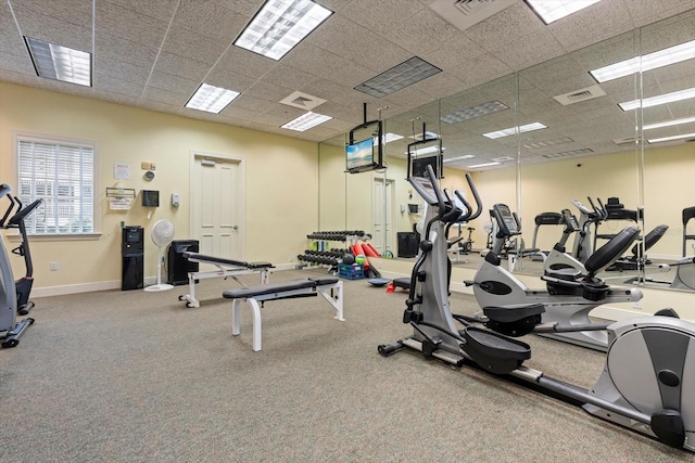 workout area with a paneled ceiling