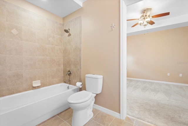 full bath with toilet, tub / shower combination, ceiling fan, tile patterned flooring, and baseboards