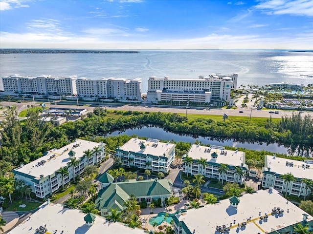 birds eye view of property with a view of city and a water view