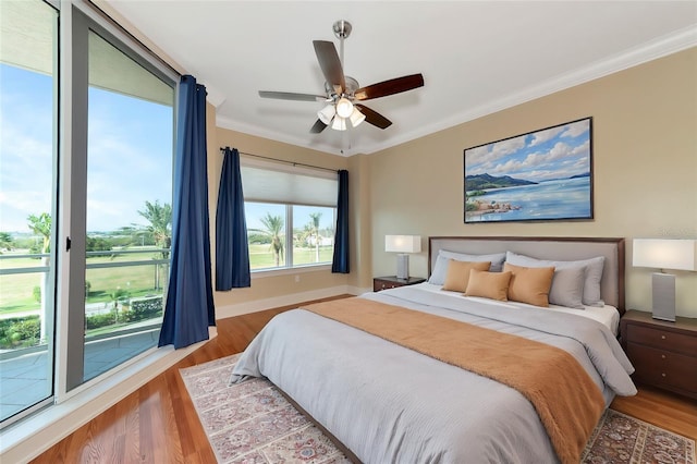 bedroom with ornamental molding, access to outside, light wood-type flooring, and ceiling fan