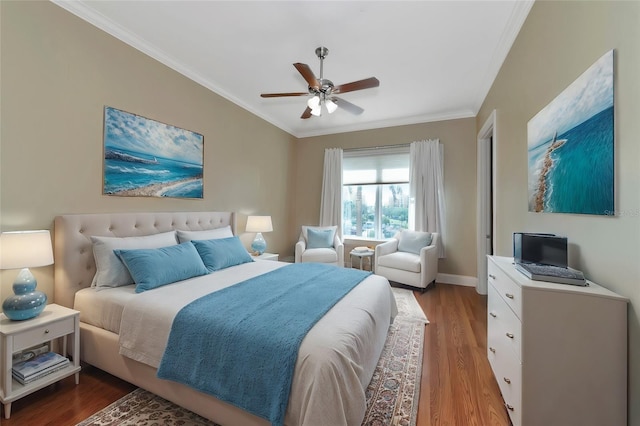 bedroom featuring wood-type flooring, ceiling fan, and crown molding