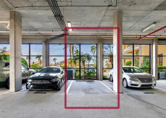 view of vehicle parking featuring a carport