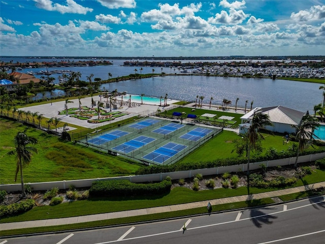 birds eye view of property with a water view