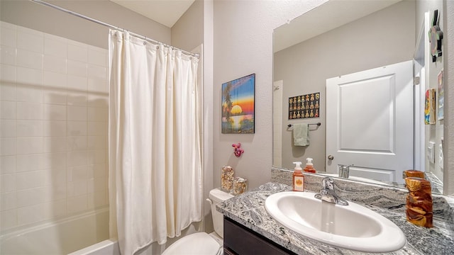 full bathroom featuring shower / bath combo with shower curtain, vanity, and toilet