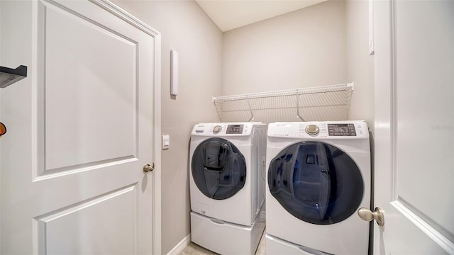 laundry room with washer and clothes dryer