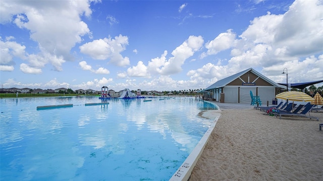 view of swimming pool with a water view