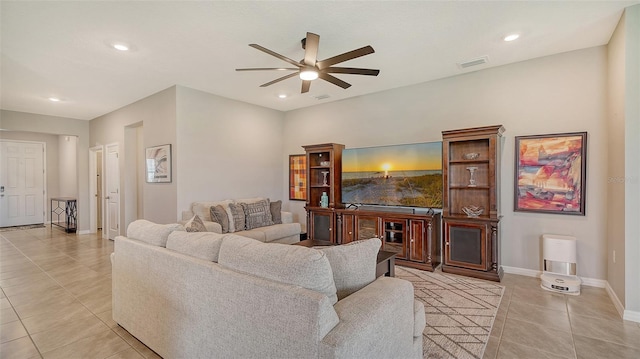 tiled living room with ceiling fan