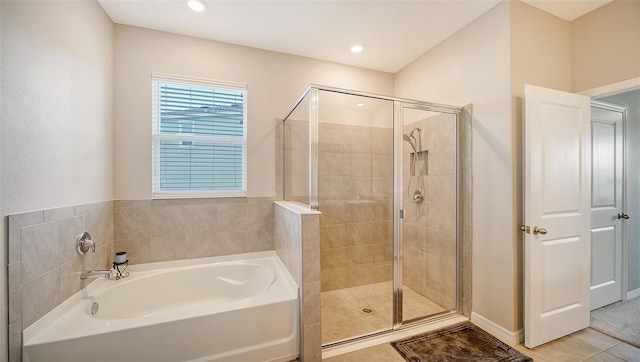 bathroom with tile patterned flooring and independent shower and bath