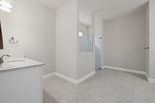 bathroom featuring vanity and a shower