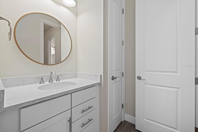 bathroom with vanity and tile patterned flooring