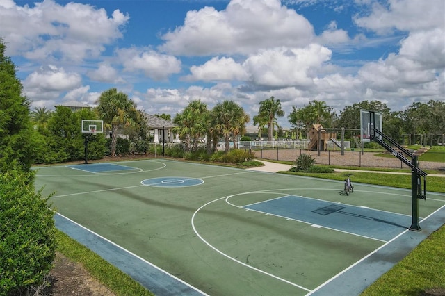 view of sport court featuring a playground