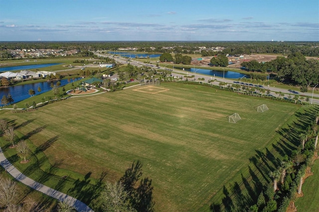 birds eye view of property featuring a water view and a rural view