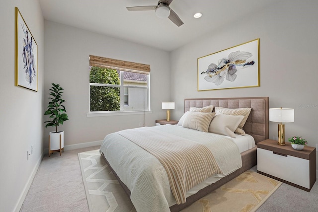 bedroom featuring ceiling fan and light colored carpet