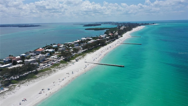 aerial view with a water view and a view of the beach