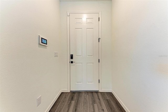 doorway featuring dark hardwood / wood-style floors