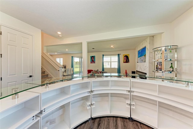 kitchen with a textured ceiling and hardwood / wood-style flooring