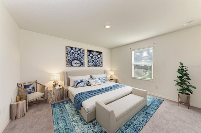 bedroom featuring light colored carpet