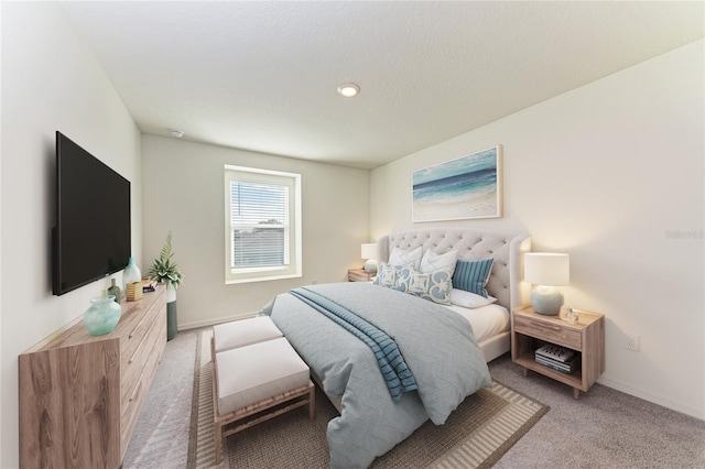 bedroom with light colored carpet