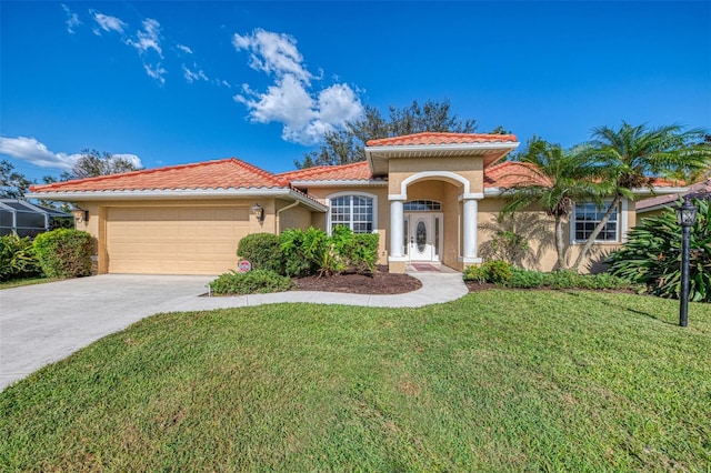 mediterranean / spanish-style home featuring a garage and a front lawn