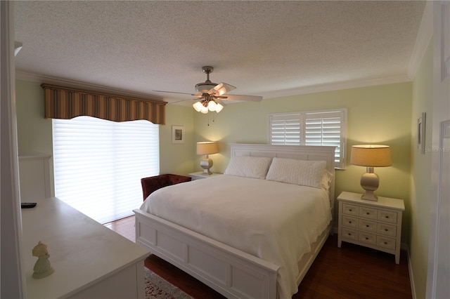 bedroom featuring ceiling fan, access to outside, ornamental molding, a textured ceiling, and dark hardwood / wood-style floors