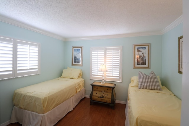 bedroom with multiple windows, a textured ceiling, and dark hardwood / wood-style flooring