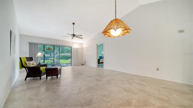 interior space with high vaulted ceiling and ceiling fan