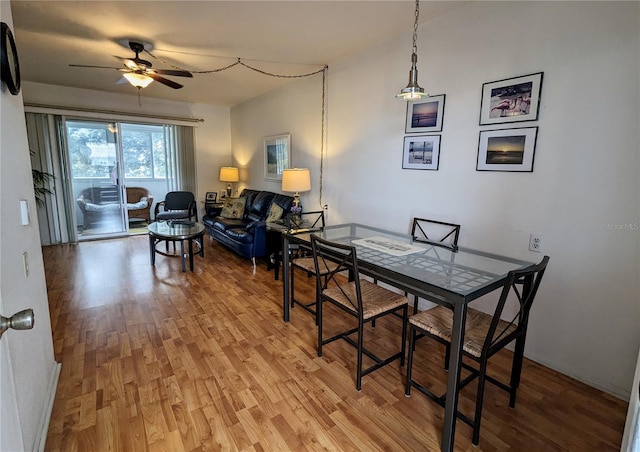 dining space featuring ceiling fan and light hardwood / wood-style flooring