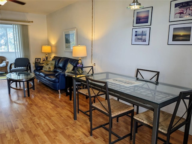 dining space featuring light hardwood / wood-style floors and ceiling fan