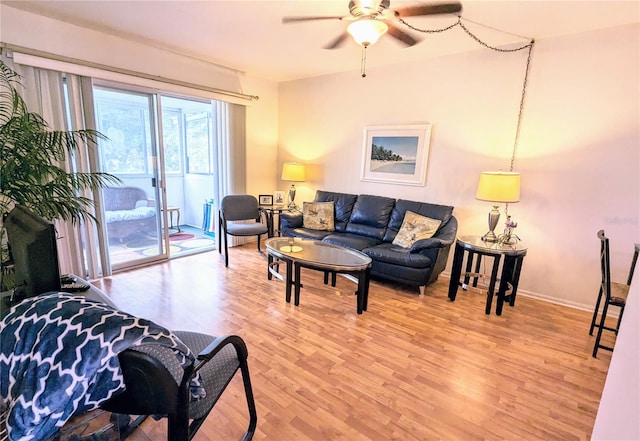 living room with ceiling fan and hardwood / wood-style flooring