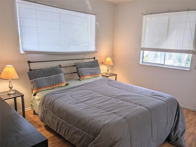 bedroom featuring hardwood / wood-style flooring