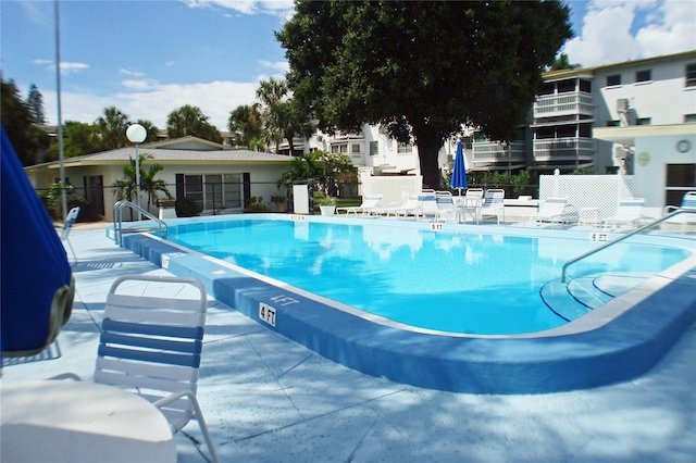 view of swimming pool featuring a patio area