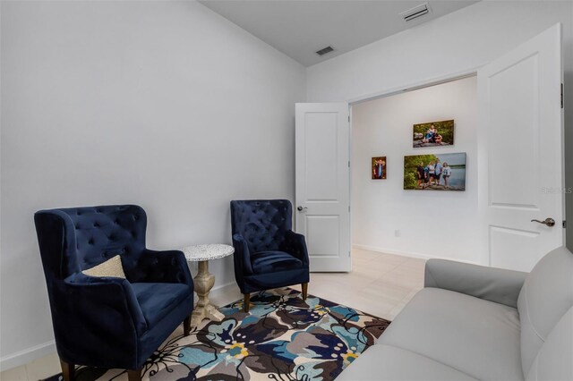 living room featuring light tile patterned flooring