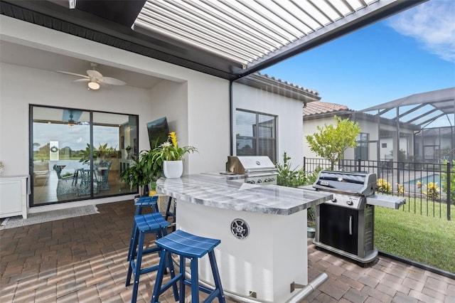 view of patio with an outdoor bar, a lanai, ceiling fan, and a grill