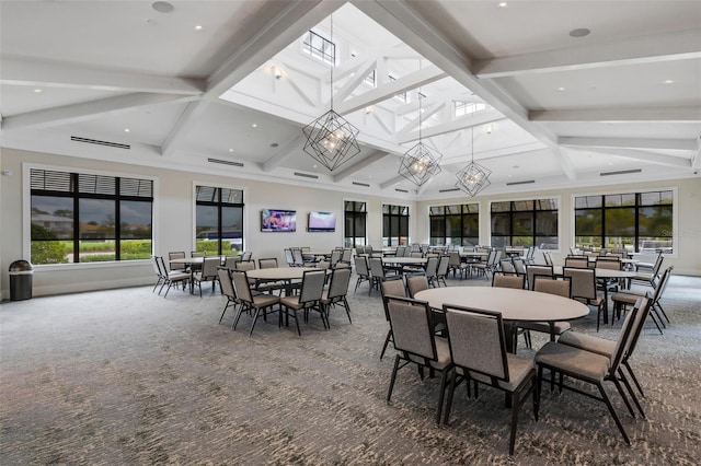 carpeted dining room with beamed ceiling and a notable chandelier