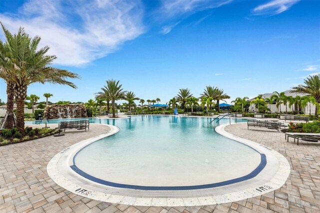 view of swimming pool featuring a patio